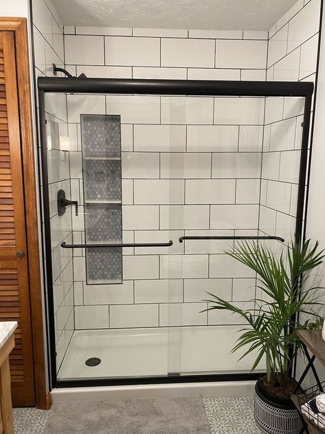 Black Grout White Subway Tile, Big White Subway Tile Bathroom, White Shower Tile Dark Grout, Subway Tiled Shower Ideas, Large White Tile Black Grout, White Tile Black Fixtures Bathroom, White Shower Black Grout, Showers With Black Fixtures, Subway Tile With Black Grout Bathroom