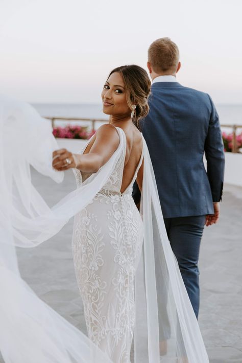 Grandiose Beach Wedding With Colorful Accents and Tropical Details | a&bé bridal shop | photographer: ﻿x﻿imena zermeno | made with love bridal | made with love wedding dress | fitted lace wedding dress | plunging neckline wedding dress | wedding dress tulle wings | beach wedding | beach elopement | Mexico wedding | Cabo wedding | wedding inspiration | pink wedding flowers | wedding florals | colorful wedding accents | blue and pink wedding accents | #aandbebridalshop Bridals On The Beach, Wedding Photos In The Ocean, Cabo Wedding Photos, Plunging Neckline Wedding Dress, Wedding Pictures Beach, Tropical Wedding Venue, Laguna Beach Wedding Photos, Fitted Lace Wedding Dress, Wedding Fireworks