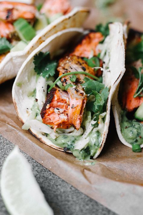 Blackened Salmon Tacos with Avocado Cilantro Sauce and Cabbage Slaw — The Feministe Elevated Meals, Salmon With Cabbage, Blackened Salmon Tacos, Salmon Tacos Recipe With Slaw, Taco Salmon, Cajun Salmon Tacos With Mango Slaw, Citrus Slaw Fish Tacos, Grilled Salmon Tacos, Blackened Salmon