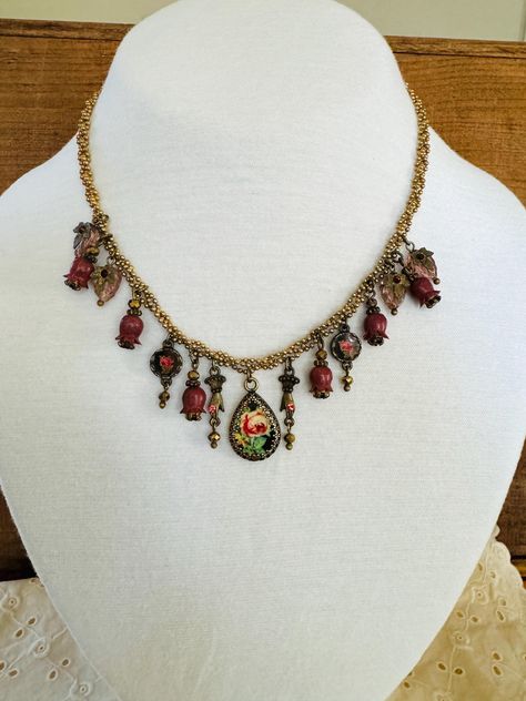 Michal Negrin necklace. With a Roses cameo, plum bell beads, Victorian hand charms and sparkling Swarovski crystals. Length 16" with 2" extender  very good condition- pre-owned Michal Negrin Jewelry, Victorian Hand, Michal Negrin, Hand Bells, Rosé Hands, Crystal Charm, Dark Academia, Passion For Fashion, Crystal Necklace