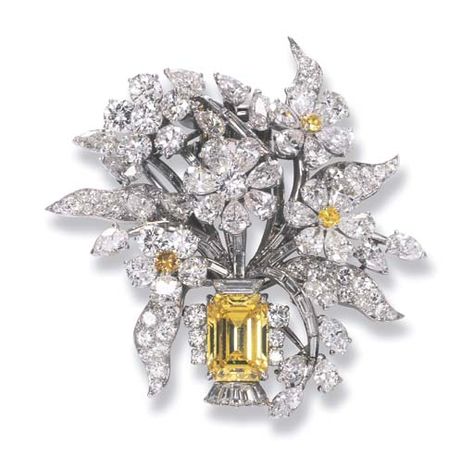 A COLOURED DIAMOND AND DIAMOND FLORAL BROOCH, BY BULGARI   The rectangular-cut fancy intense yellow diamond weighing 3.82 carats to the diamond floral bouquet with yellow diamond detail, mounted in platinum, circa 1960, 4.2 cm. high, with beige Bulgari pouch  Signed Bulgari Diamond Flower Brooch, Bijoux Art Nouveau, صفحات التلوين, Leaf Brooch, Flower Leaf, Diamond Brooch, Diamond Flower, Fabulous Jewelry, Yellow Flower