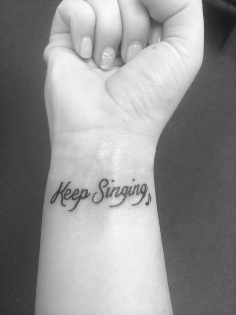 My Keep Singing wrist tattoo with a little music note next to it. Cute and girly and so meaningful! Music Words Tattoo, Sing Tattoo Music, Sing Tattoo Small, Music Lyric Tattoos For Women, Meaningful Music Tattoos, Singing Tattoo Ideas, Singing Tattoo, Music Staff Tattoo, Music Graduation