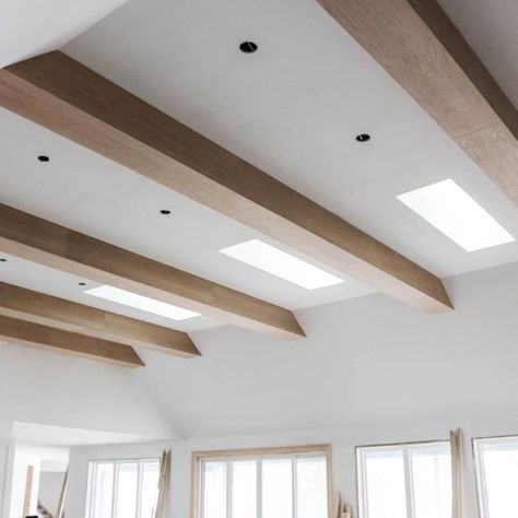 We love how these wooden beams turned out..The perfect way to fill out 14ft tall ceilings! Ceiling Beams Basement, Modern Beamed Ceiling, Gray Beams Ceiling, Light Beams Ceiling, Wooden Beams Lighting, Slanted Ceiling Wood Beams, Beams On Textured Ceiling, Wood Beams On Angled Ceiling, Wooden Beams Ceiling Lighting