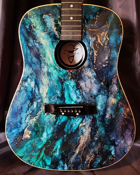 One of a kind beautiful, functional, hand painted, epoxy resin custom guitar. Made with quality epoxy resin and color pigments. UV, water, heat, and scratch resistant. #epoxy #resinart #alcoholink #custom #guitar #art #music #smallbusiness #marble Brand new, triple varnished, epoxy coated and painted. Resin Guitar, Custom Acoustic Guitars, Resin Paint, Guitar Making, Epoxy Art, Epoxy Resin Crafts, Epoxy Resin Art, Epoxy Coating, Custom Guitar