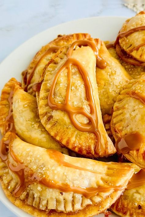 Southern Peach Hand Pies, easy peach hand pies recipe, peach dessert recipes, homemade hand pies, summer peach desserts, peach pie with premade crust, best hand pie recipes, southern dessert ideas, quick peach hand pies, individual peach pies, simple peach hand pie recipe, how to make hand pies, peach hand pies with frozen peaches, mini peach pies Peach Hand Pies, Premade Pie Crust, Southern Desserts, Hand Pies, Southern Hospitality, Eat Dessert First, Eat Dessert, Sweet Treat, Natural Brown