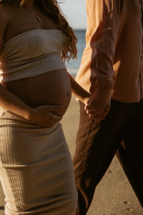 Maternity photoshoot couple poses at the beach Beach Stairs Photoshoot, Maternity Photoshoot Poses Outdoor, Pregnant Couple Photos, Pregnancy Photoshoot Couple, Pregnancy Shoot Beach, Pregnancy Beach Photos, Maternity Photo Shoot Ideas Beach, Pregnancy Beach Photoshoot, Beach Pregnancy Pictures