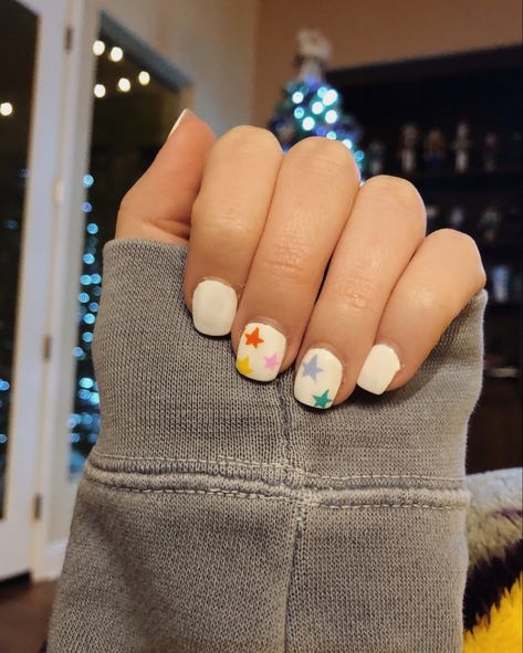 white nails with colorful stars #nails #nailart #stars #color White Colorful Nails, Colorful Star Nails, White Nails With Stars, Luminary Nails, Nail Polish Tutorial, Stars Nails, Tan Nails, Star Nail Designs, Nail Pics