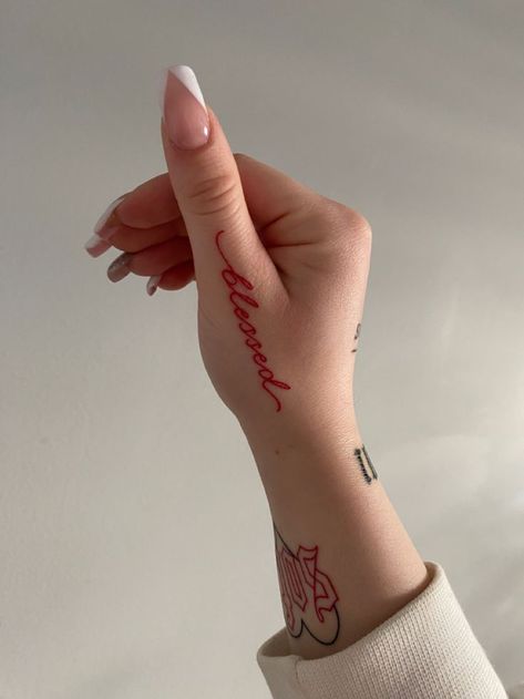 Red Finger Tattoos For Women, Red Tattoo Women, Little Hand Tattoos For Women, Red Ink Hand Tattoo, Hands Tattoo For Women, Hand Tats For Women, Word Hand Tattoos, Women Hand Tattoos Ideas, Red Tattoo Aesthetic