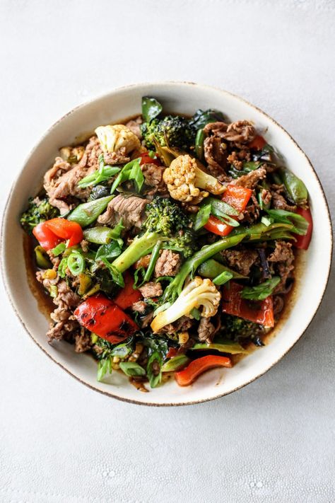 This savory, vegetable packed miso stir fry is a delicious and healthy 30 minute meal. Made with 3 different types of brassica (broccolini, cauliflower, and kale), along with red peppers and snap peas, this dish is crunchy, vegetable forward, and delicious. You can make it with any protein for a versatile dish to serve over rice. Miso Stir Fry, Cauliflower And Kale, Shaved Beef, 30 Minute Meals Healthy, Serve Over Rice, Cucumber Avocado Salad, Cooking Tofu, Beef Rice, Easy Stir Fry