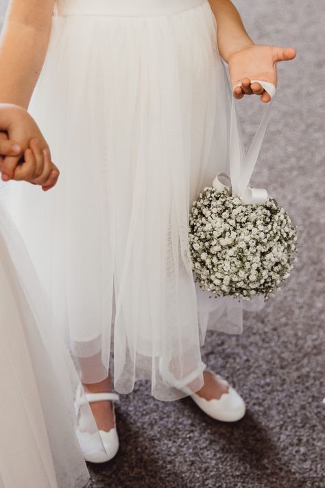 Perfect for flower girls, a pomander ball of gypsophila is an elegant alternative to a bouquet | Applewood Hall in Norfolk is a beautiful blank canvas marquee wedding venue. Flower Girl Flower Ball, Flower Girl Bouquet Alternative, Ivory Wedding Decor, Black Tie Ball, Ball Bouquet, Festival Style Wedding, Gypsophila Flower, Pomander Balls, All Inclusive Wedding Packages