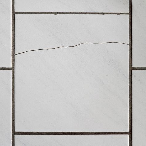 Difficulty Beginner Duration Under 2 hours Aside from being unsightly, cracked floor tile creates an opening that can allow moisture to reach the subfloor. Water can trickle behind a cracked wall tile in a shower or bath. To reduce the risk of water damage, especially in damp areas like the bathroom, you should repair cracked tiles as soon as possible. Cracks in wall tiles can also   This guide outlines how to fix cracked tile. You may be able to patch a hairline crack, but if the break i Ceramic Tile Floor Kitchen, Bathroom Tile Diy, Concrete Shower, Painting Bathroom Tiles, Tile Repair, Glamour Home, Cracked Wall, Shower Floor Tile, Bathroom Shower Tile