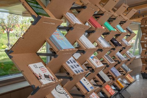 Go 'Back to the Future' in This Temporary Bookstore in Xinyang Book Exhibition, Book Installation, Models Architecture, Bookstore Design, Vinyl Mural, Houston Restaurants, Concept Models Architecture, Booth Ideas, Library Design