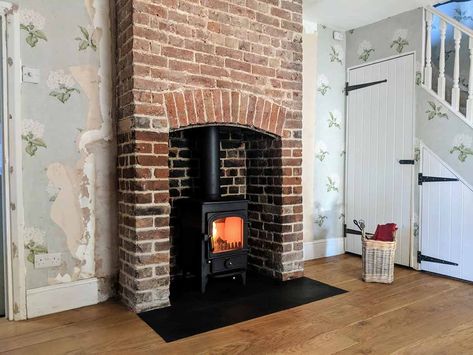 An original Georgian red brick fireplace was uncovered and restored and installed with a Clearview Pioneer 400 wood stove in Stambridge, Essex Brick Fireplace Log Burner, Exposed Brick Fireplaces, Wood Burner Fireplace, Wood Stove Hearth, Design Camino, Log Burner Fireplace, Log Burner Living Room, Red Brick Fireplaces, Brick Fireplaces