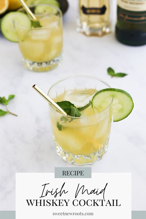 A yellow-green cocktail in a rocks glass with a gold straw and a garnish of mint leaf and cucumber sits on a white table with the same cocktail in the background and several whiskey bottles. Irish Maid Cocktail, Irish Cocktails, Classic Gin Cocktails, Irish Drinks, Day Cocktails, Honey Simple Syrup, Cocktail Pitcher, Gin Recipes, Whiskey Cocktail