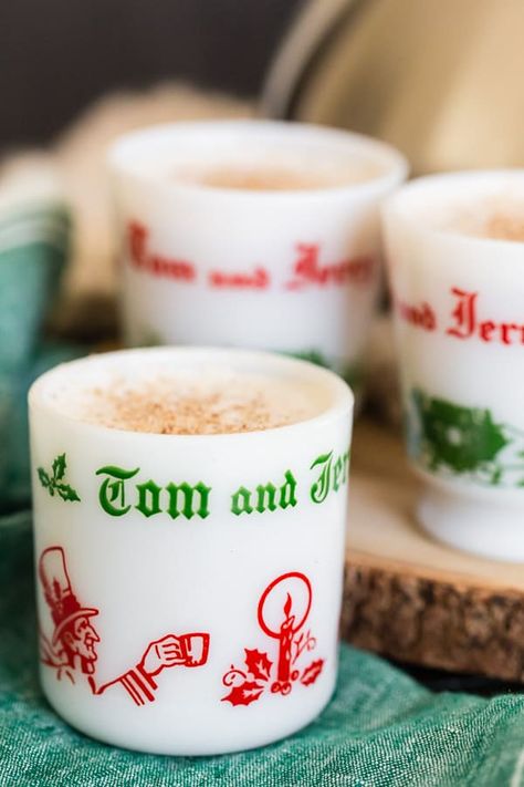 This Tom and Jerry cocktail recipe is the perfect boozy treat to keep you happy all holiday season long! You start with a delicious batter mixed with hot water or milk and just a splash (or two!) of spiced rum. This vintage cocktail is about to make a big comeback! #tomandjerry #cocktail #nutmegnanny Tom And Jerry Cocktail Recipe, Tom And Jerry Drink, Tom And Jerry Batter, Vintage Tom And Jerry, Fall Cocktail Party, Holiday Beverages, Christmas Salad, Batter Mix, Fall Cocktail