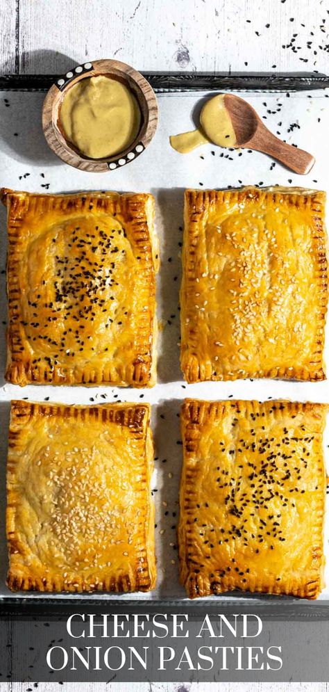 Four cheese and onion pasties on a baking sheet with a small bowl of mustard. Cheese And Onion Pasty, Puff Pastry Shells, Chicken Puffs, Pasties Recipes, Caramelised Onion, Potato Cheese, British Dishes, Nigella Seeds, Easy Cheese