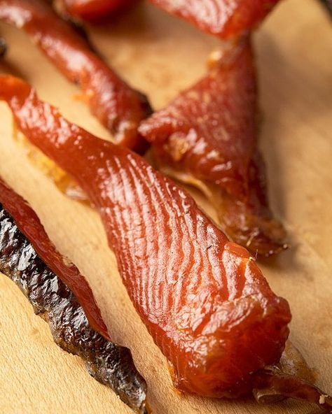 Salmon jerky closeup photo Salmon Jerky In Smoker, Dehydrated Salmon Jerky, Smoked Salmon Jerky, Salmon Jerky Dehydrator, Salmon Jerky Recipe, Dehydrated Salmon, Candied Salmon Recipe, Salmon Candy, Jerkey Recipes