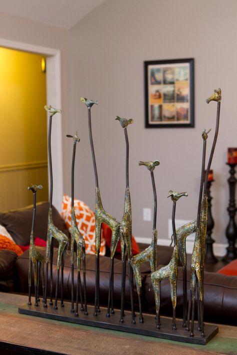 LIVING ROOM, AFTER: Fun decor items like this giraffe sculpture add character to the living room after a renovation by the Property Brothers. Giraffe Accessories, Giraffe Craft, Giraffe Sculpture, Giraffe Crafts, Giraffes Cant Dance, Giraffe Decor, Emoji Love, Giraffe Art, Property Brothers