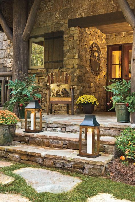 Simplicity and Stone - Front Porches That Have Us So Ready for Fall  - Southernliving. Dress up your stone porch with glowing lanterns and pots filled with autumn bloomers, like these gold and crimson mums. Stepping Stone Crafts, Stone Porches, Front Door Steps, Stone Steps, Rustic Porch, Porch Wall, Porch Steps, Exterior Ideas, Outdoor Porch