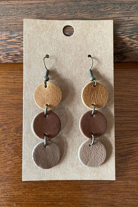 "Genuine leather earrings upcycled from post consumer waste - giving it a new life and keeping it out of the landfill! Very lightweight hook earrings.  These earrings measure 2.25\" in drop from top of ear wire. Features bronze colored accent and earring post.  *ORDERING INFO* This listing is for one pair of leather earrings.  Each pair of earrings comes on an earring card with rubber back.  All orders come beautifully packaged in a re-usable muslin bag, perfect for gifting! Our genuine leather have a natural back, and some of our leathers it can be a bit fuzzy. Natural leather may have slight variations due to natural product. Pairs are very closely matched, however your earrings may not be identical to the earrings pictured. We want to make sure you are happy with your purchase.  If you Rustic Earring Displays, Leather Scrap Jewelry, Unique Leather Earrings, Simple Leather Earrings, Handmade Leather Earrings, Leather Earrings Ideas, Circuit Earrings, Make Leather Earrings, Leather Belt Crafts