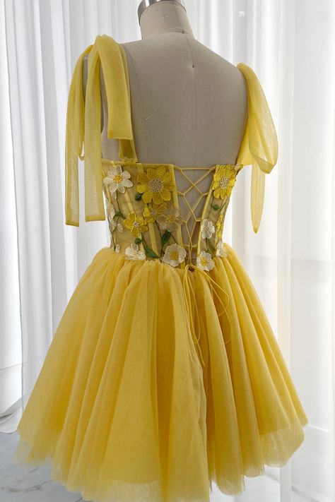 Add a cheerful touch to your look with this Sweetheart Neckline Corset Floral Embroidery Yellow Dress. Perfect for special occasions, it features intricate floral embroidery and a flattering corset silhouette with tie straps. Perfect for feeling gorgeous and feminine. Bust and Skirt with full lining. 100% Polyester 100% Recycled polyester lining Concealed zip at centre back Imported Yellow Corset Dress Short, Yellow Corset Outfit, Renisance Fair, Princess Dress Yellow, Yellow Hoco Dress, Corset Dress Short, Homecoming Dresses Yellow, Corset Silhouette, Prom Dress Cute