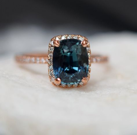 Teal sapphire engagement ring. Peacock green sapphire 3.3ct cushion sapphire diamond ring 14k Rose gold. Engagenet rings by Eidelprecious. Peach Sapphire Rings, Teal Sapphire Engagement Ring, Teal Sapphire, Custom Wedding Rings, Diamond Anniversary Rings, Jewelry Wedding Rings, Dream Engagement Rings, Sapphire Engagement Ring, Peacock Green