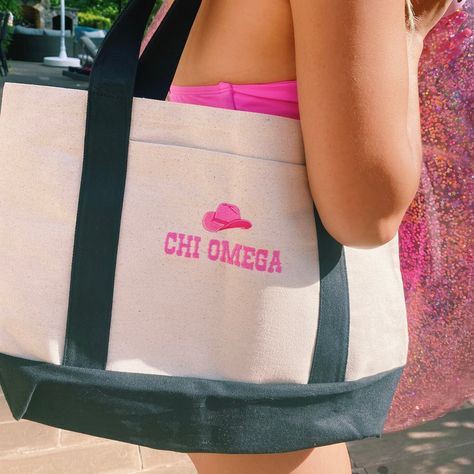 "This personalized \"howdy partner\" western sorority chapter boat tote bag is perfect for bid day bags, initiation gifts, big little reveal baskets, etc!  Photo Features:  1-3. Black tote bag  Information: ⭑ Premium 11 ounce cotton canvas tote bag  ⭑ Unstructured, gusseted bottom ⭑ Front pocket, dimensions: 7.5\" W x 8\" H ⭑ Dimensions: 19\" H x 12\" D x 4.5\" W  ⭑ Handles are 24\" long (12\" on each side)  This listing is for ONLY the tote bag. Any other items in the pictures can most likely b Adpi Recruitment, Sorority Baskets, Big/little Baskets, Little Gifts Sorority, Big Little Canvas, Big Little Basket, Boat Tote, Tri Sigma, Sorority Bid Day