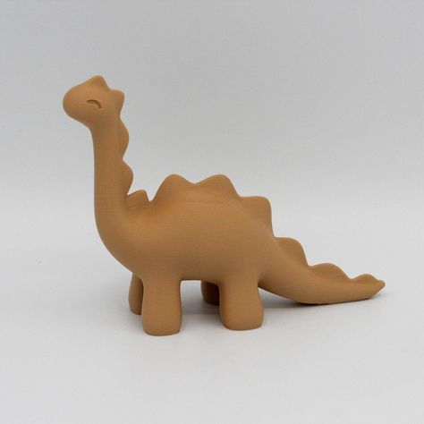 Add prehistoric charm to your space with our adorable dinosaur figurine. This charming desk or decoration piece features a delightful design, bringing a touch of whimsy to any room. Crafted with attention to detail, it's a perfect addition for dino enthusiasts and a conversation starter for all. Get transported back in time.  Features: 1️⃣ Adds a perfect flair to any dinosaur lovers desk, home or office. 2️⃣ Made using 100% renewable energy in Beaverton, Oregon. 3️⃣ Compact size: fits any displa Simple Ceramic Sculpture, Diy Clay Dinosaur, Cute Clay Dinosaur, Air Dry Clay Dinosaur, Dinosaur Clay Sculpture, Dinosaur Pottery, Clay Dino, Clay Dinosaur, Dinosaur Figurine