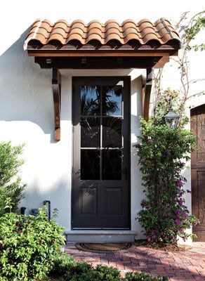 Spanish Style Front Door, Spanish Home Exteriors, Window Pergolas, Mediterranean Doors, Door Overhang, Spanish Exterior, Mediterranean Homes Exterior, Spanish Colonial Homes, Spanish Style Architecture