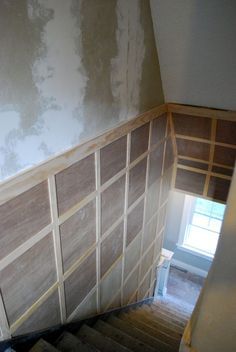 When you have a stairway with lots of damage, you have to be ready to deal with lots of repair. Or you have to get creative. In our case, we got creative. We chose to install a type of board and batten on the staircase to create an upscale look, and to avoid all the wall repair … Square Board And Batten, Stairway Walls, Basement Staircase, Basement Remodel Diy, Staircase Remodel, Staircase Wall, Decor Fireplace, Basement Stairs, Basement Makeover