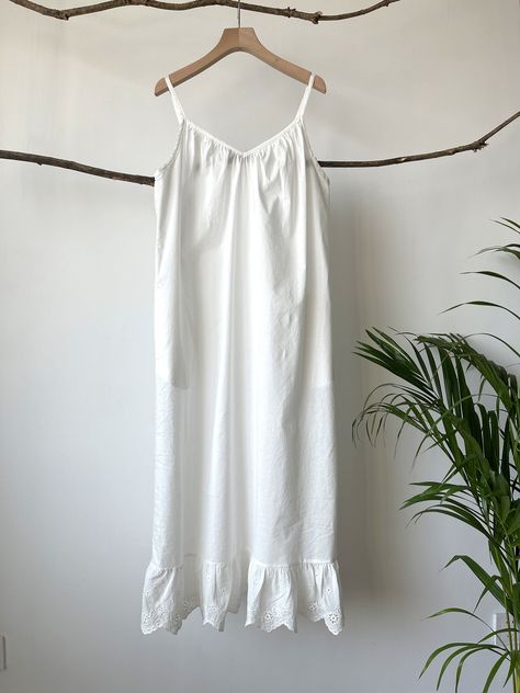 "100% Premium quality cotton slip, cling free, soft, comfortable and no itch. An exquisite accessory for your wardrobe, this soft and light slip can be worn to layer under any sheer caftans, tunics, dresses (as shown in the picture), traveling, and just as a lovely night dress at home. -100% cotton -Ankle length -Gathered front panel -Eyelet hem -Slightly A-line shaped -Adjustable spaghetti straps Please provide your full bust measurement ( measured around the fullest part )and your height along Cotton Slip Dress, Linen Camisole, Purple Christmas Tree, Slip Dress Black, Natural Clothing, Cotton Slip, Linen Fashion, Linen Tank Top, Black Slip Dress