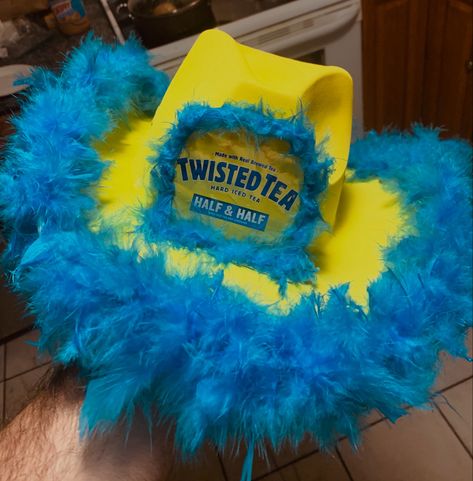 Yellow Hat, Blue Boa, Twisted Tea Can Drink Themed Cowboy Hat, Diy Cowboy Hats Alcohol, Cowgirl Liquor Hats, Cowboy Hat Drinks, Drinking Cowboy Hat Diy, Liquor Cowgirl Hats Diy, Twisted Tea Cowboy Hat, Alcoholic Drink Cowboy Hats, Drink Cowgirl Hats