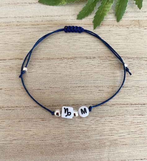 "Personalised Initial & Zodiac Sign Wish Bracelet, Unisex Adjustable Macramé Cord Bracelet, Star Sign Lover, Birthday Gift Bracelet, Uk Shop Super cute \"wish\" bracelet featuring a personalised quality acrylic initial and cubed zodiac charm on an adjustable waxed cotton navy cord. Completed with round silver plated beads (lead and nickel free) to bring out the beauty of the personalised charms. This adorable wish bracelet has a sliding macramé knot to make it comfortable to slide and fit around Lover Birthday, Bracelet Star, Gift Bracelet, Macrame Knot, Cord Bracelet, Wish Bracelets, Macrame Cord, Star Sign, Personalized Initials