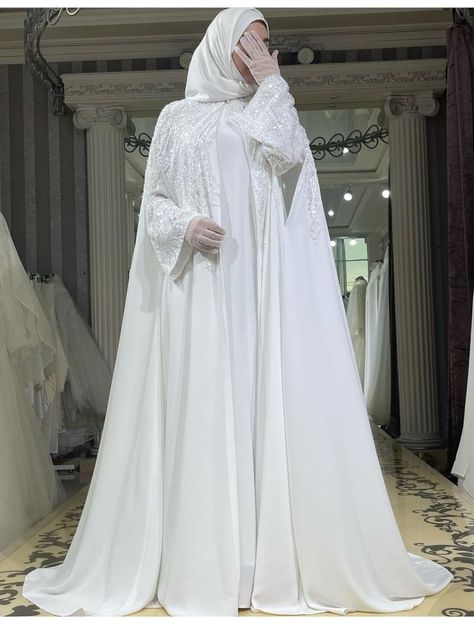 Hijab style for wedding Wedding Abaya Bridal Collection, Jilbab Wedding Dress, Bridal Abaya Hijab Bride, Nikkah Abaya Aesthetic, Nikkah Abaya White, White Abaya Wedding, Muslimah Wedding Dress Simple, Modest Wedding Dresses Hijab, Simple Nikkah Dress