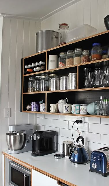 exposed ply shelving with black contrasting laminate sides and back Open Kitchen Shelves With Soffit, Open Kitchen Cupboards, Open Box Shelves Kitchen, Black And Plywood Kitchen, Black Dishes Open Shelves, Plywood Open Shelving, Open Kitchen Cabinets, Kitchen Open Shelves, Plywood Kitchen