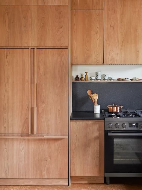 Hoe to brighten up a room? In this kitchen renovation, it was pairing cherry cabinets with black countertops that did the trick—and it looks anything but '90s. Click the pin to see the full before and after remodel. Scream 90s, 1990s Kitchen, Shallow Pantry, Cherry Wood Kitchen Cabinets, Cherry Wood Kitchens, Cherry Wood Cabinets, Dark Counters, Cherry Kitchen, Cherry Cabinets