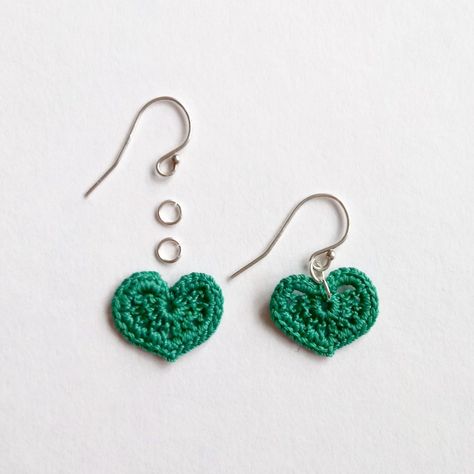 Learn how to make your own accessories with these lovely micro-crochet heart earrings! Create your own set with this free crochet pattern! This basic and beginner friendly DIY project is perfect for any crocheter that enjoys smaller work. A standout piece that will turn heads and makes for great crochet jewelry. It can work up quickly. Working with simple stitches, the single crochet, any color will look great in your wardrobe! You will need to have ear wires and jump rings! These crochet ... Earrings At Home, Crochet Ghost, Crochet Bat, Crochet Hearts, Micro Crochet, Crochet Heart Pattern, Crochet Jewelry Patterns, Bat Earrings, Crochet Earrings Pattern