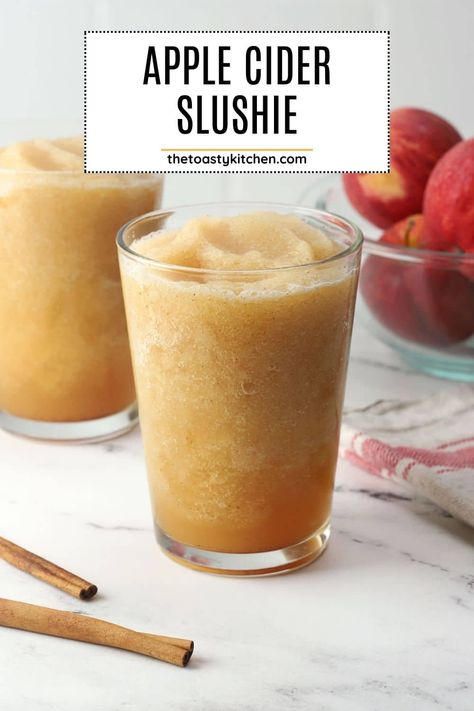 Apple cider slushies by The Toasty Kitchen. Has fall arrived but the weather isn't cooperating? Make a batch of apple cider slushies! They're packed with fresh apple flavor, a hint of cinnamon, and vanilla. #applecider #applecideslushie #slushies #fallslushies #falldrink Apple Julep Apple Barn, Caramel Apple Slushie, Apple Cider Slushy Recipe, Cider Slushies Recipe, Apple Cider Slushy, Apple Slushies Recipe, Carmel Apple Cider Drink, Apple Cider Slushies Recipe, Apple Fall Drinks