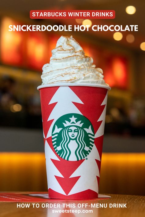 A Starbucks snickerdoodle white hot chocolate with cinnamon sugar sprinkles on top of whipped cream. Starbucks Snickerdoodle Hot Chocolate, Snickerdoodle Hot Chocolate Starbucks, Hot Chocolate Starbucks Recipe, Starbucks White Hot Chocolate Order, Best Holiday Starbucks Drinks, Starbucks Hot Chocolate Drinks Orders, White Hot Chocolate Starbucks, Hot Chocolate Starbucks Drinks, Snickerdoodle Starbucks Drink