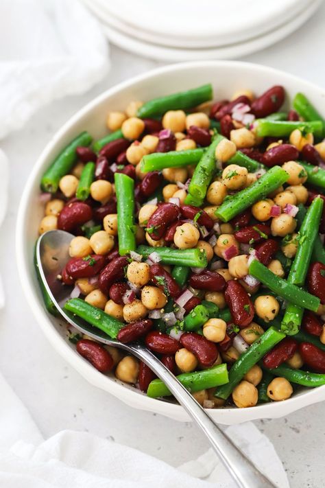 This healthy 3-bean salad recipe is a light, refreshing side dish for summer BBQs, picnics & potlucks. We use a classic bean salad combination of green beans, red kidney beans, and chickpeas (garbanzo beans), finished with a light vinaigrette. This marinated bean salad ends up so light and fresh. It's also gluten-free, dairy-free, vegan, and naturally sweetened--the perfect summer side dish! Marinated Bean Salad, Cooking Frozen Green Beans, Bean Salad Recipes Easy, Bean Salad Dressing, Bean Protocol, 3 Bean Salad, Street Corn Salad, 30 Days To Healthy Living, Three Bean Salad