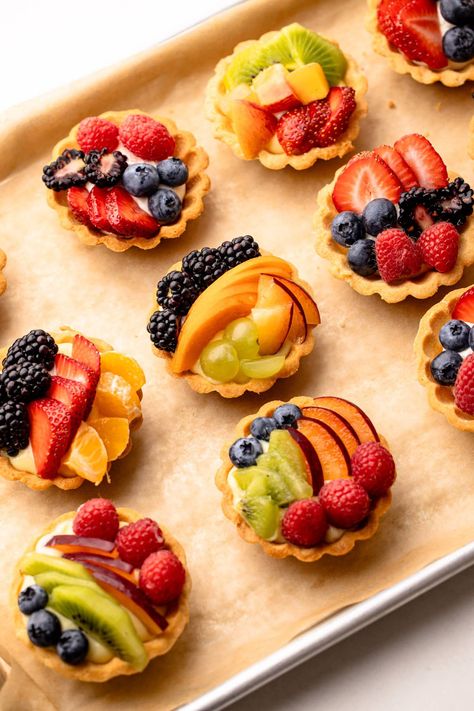 These Mini Fruit Tartlets are the perfect two-bite desserts, featuring mini tart crusts filled with a simple mascarpone cream, topped with fresh fruit, and finished with an optional but beautiful glaze. Mini Tart Pan Recipes, Fruit Tarts Recipe Dessert, Fruit Tarts Mini, Mini Fruit Tart Recipe, Mini Fruit Tart, Fruit Tart Recipe Mini, Mini Lemon Tarts, Fruit Tartlets, Mini Tartlets