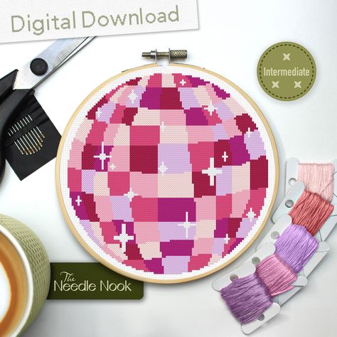 This adorable disco ball will bring a pop of pink magic to your walls! Instant PDF Download Only! No physical product will be sent to you, instead enjoy the convenience of a digital download, allowing you to access the pattern instantly and begin stitching right away. Please read the description before purchasing! Key Pattern Information: - 100 x 100 Stitches - 7 DMC Colours - Skill Level: Intermediate Finished Sizes: - 14ct Aida = 7.1 x 7.1" (18.0 x 18.0cm)  - 16ct Aida = 6.3 x 6.3" (16.0 x 16. Disco Ball Cross Stitch Pattern, Diy Y2k, Cross Stitch Gifts, Craft Wall Decor, Pink Disco Ball, Pink Diy, Pink Magic, Pink Disco, Craft Wall