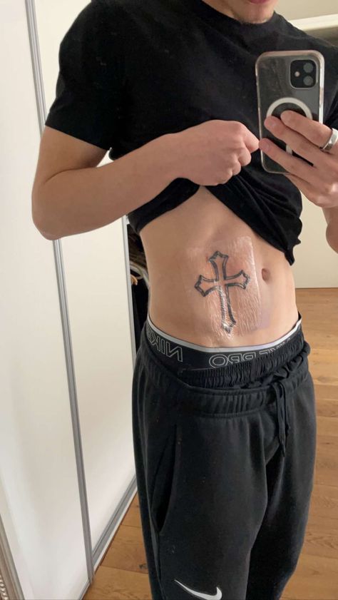 Cross On Back Tattoo Men, Right Side Chest Tattoo Men, Men’s Torso Tattoos, Chest Tattoo Background Ideas, Cross On Stomach Tattoo, Mens Ab Tattoos, Cross Rib Tattoo Men, Chest Tattoo Men Cross, Faith Tattoos Men