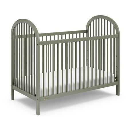 Introducing the Graco Olivia 3-in-1 Convertible Crib. With its clean lines, stylish curves, rounded details, and easy-to-match, arched design, the Olivia is the perfect addition to any nursery no matter your style. The Olivia is crafted from pine wood, and its applied finish has been tested to meet or exceed the applicable ASTM and CPSIA safety standards. The Olivia is JPMA Certified meaning it's been expertly tested by third-party, accredited laboratories to meet or exceed all of the applicable Green Crib, Gender Neutral Baby Nursery, Baby Cribs Convertible, Arched Design, Baby Crib Mattress, Best Crib, Toddler Mattress, Dream Nurseries, Furniture Packages