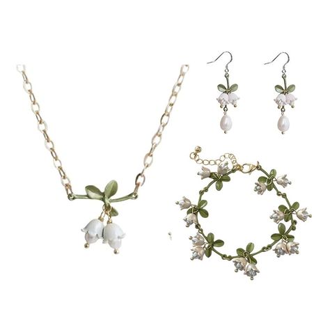 PRICES MAY VARY. Unique design:The design is inspired by lily of the valley, Representing pure love and friendship, the lily-of-the-valley flowers are white and flawless, and grow in the silent valley, which means a happy return. Fine quality metiral: The lily of the valley flower are made of enamel, gold plated on brass and natural pearl, hypoallergenic, anti-rust and anti-corrosion, no discoloration, no oxidation, suitable for sensitive skin. Great gift:The sweet Lily jewelry is a great gift f Lily Of The Valley Outfit, Sage Green Jewelry, Lily Of The Valley Jewelry, Drawing Outfits, Lily Jewelry, Lily Of The Valley Flowers, Valley Flowers, Senior Project, Women's Jewelry Sets