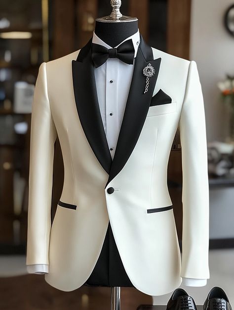 Elevate your formal look with this stunning white tuxedo. Visit our website to make it yours.   #DapperStyle #FormalElegance #menssuitstyle #mensfashion #menssuits #mensstyle #suitstyle #suits #menstyle #suitup #menswear #suitandtie #men #dapperfashion #style #suitsformen #mensfashionblog #suited Wedding Dress For Men Suits Groom Style, White And Black Wedding Suit, Ivory Suit Groom, White Tuxedo For Men Wedding, Black Suit Men Wedding, Jas Pria Wedding, Jas Wedding, White Tuxedo Wedding, Black Tuxedo Wedding