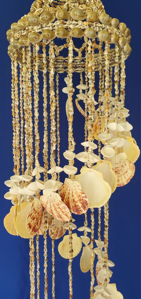 "A definite favorite! 36\" seashell stairway chandelier made of masacarensis pectin and white bubble seashells. The family of pectin (scallop), seashells make beautiful seashell chandeliers. It's the perfect seashell to remind anyone of a tropical beach. Hang it anywhere you need to decompress the day away! Handmade in the USA!" Seashell Chandeliers, Mermaid Chandelier, Stairway Chandelier, Seashell Chandelier, Earthy Decor, Shell Chandelier, Shell Crafts Diy, Beach Side, Sea Star