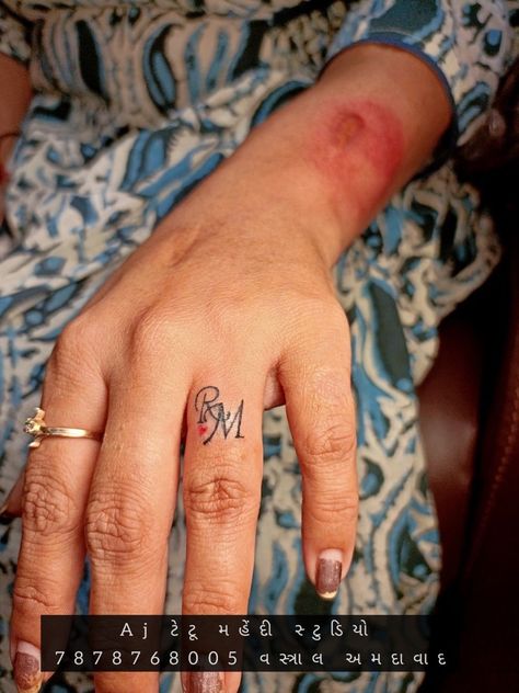 Names On Finger Tattoo, Initial Tattoo Ideas Couple Ring Finger, Initials On Finger Tattoo, Small Initial Tattoo Ideas Letters Finger, Finger Tattoos Words Letters, Marriage Tattoos Ring Finger Initial, R Finger Tattoo, Finger Tattoos Marriage, Small Letter Tattoo On Finger