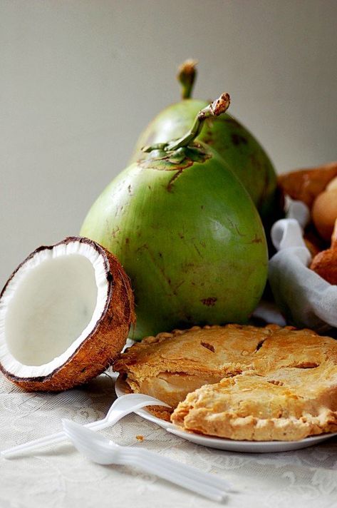 Buko Pie with Coconut Fruit martiniko, CC-BY, via flickr Buko pie is a favorite pasalubong or homecoming gift that Filipinos love giving their families, friends, and colleagues.   Buko pie is actually round, stuffed with layered slivers of meat of... Filipino Cake, Pinoy Merienda, Filipino Sweets, Buko Pie, Pinoy Dessert, Coconut Fruit, Filipino Dessert, Filipino Recipe, Filipino Dish