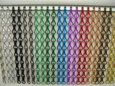 Several different colors of aluminum chain curtains are installed on the fixed track. Chain Curtain, Metal Chain Curtain, Multicolor Link Chain Jewelry, Multicolor Plastic Chain Jewelry, 70s Beads Curtain, Beaded Door Curtains, Space Dividers, Fireplace Screens, Curtain Sizes